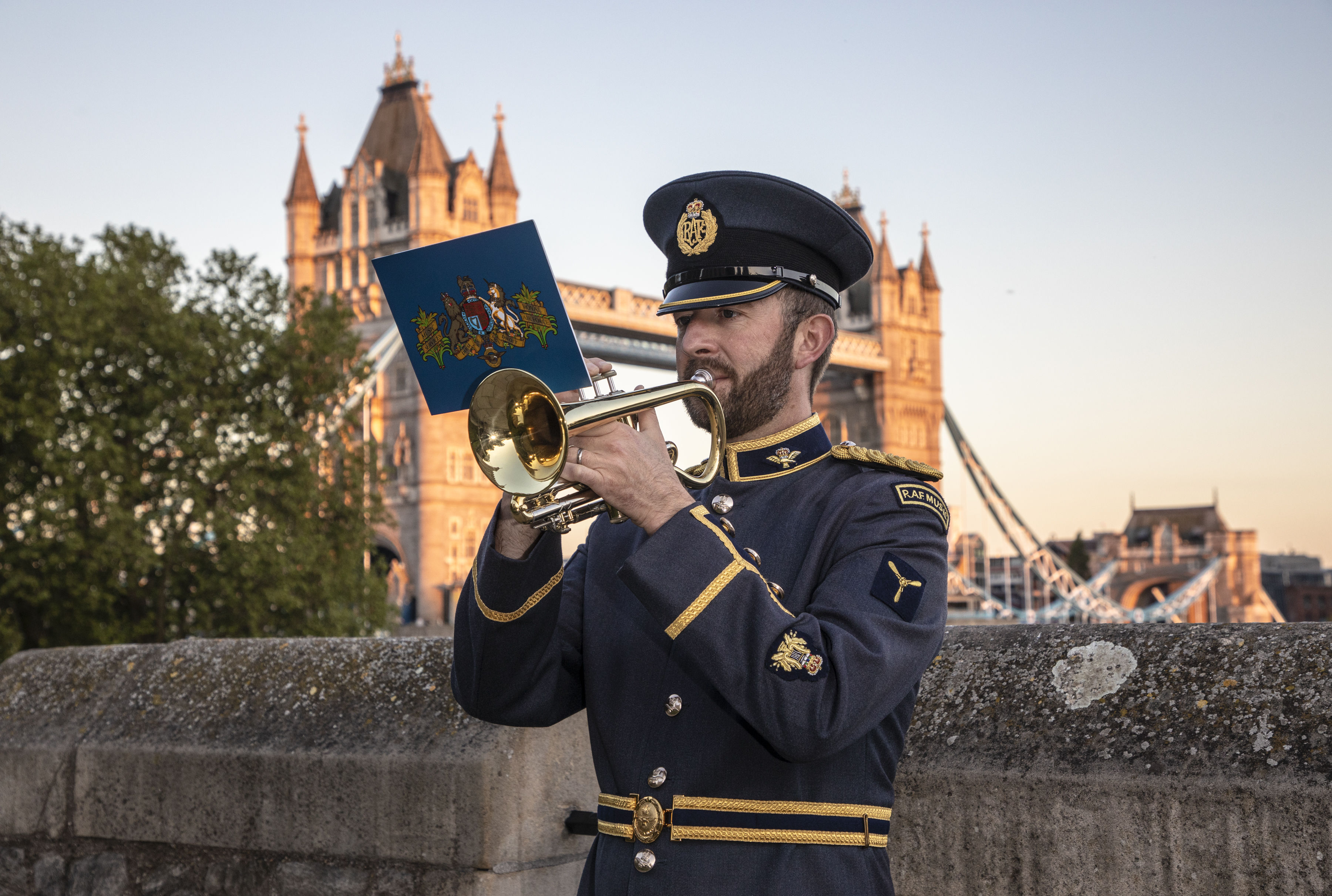 RAF trumpeter plays by the Tower of London.